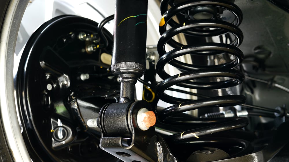 5 Symptoms of a Bad Suspension/Coil Spring, Location, & Replacement Cost