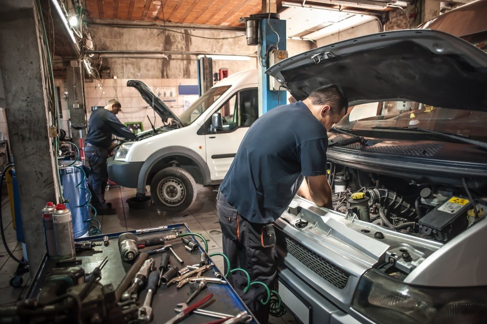 mechanics repair cars