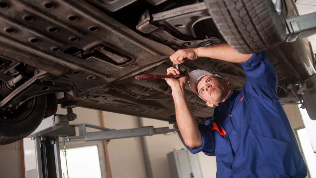 Mechanic remove engine splash shield