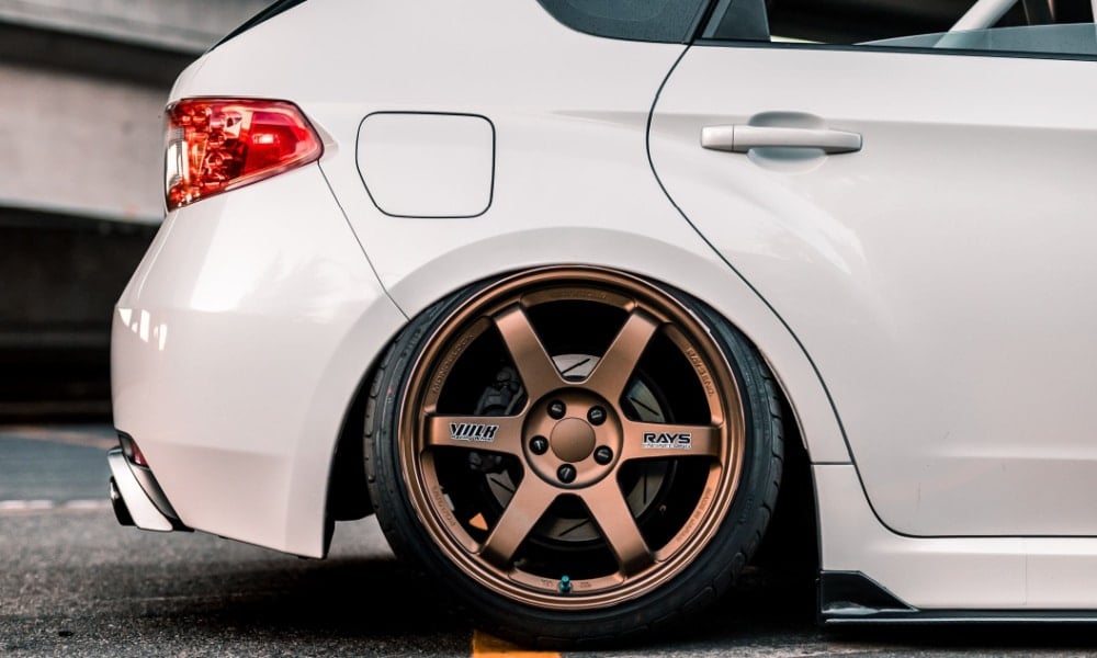 white car bronze rims