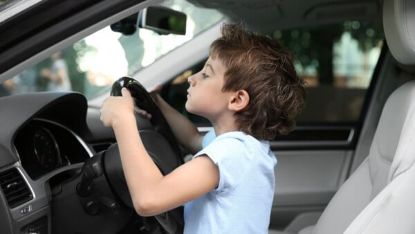 Young Driver In Car